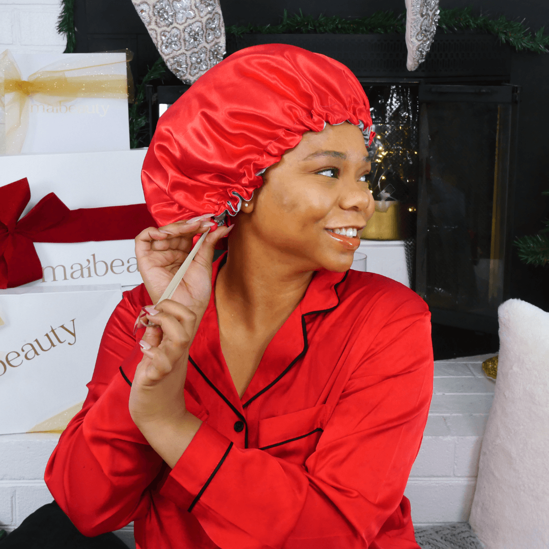 Smiling Black Woman Adjusting Red Satin Bonnet